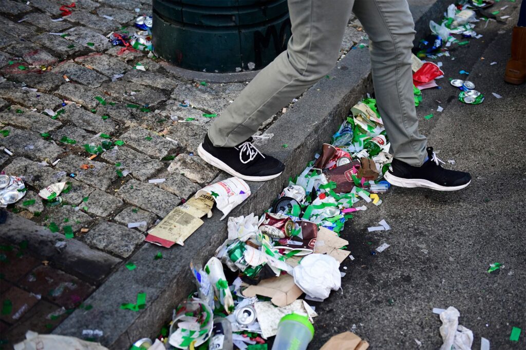 Sidewalk filled with trash from Super Bowl LVII Weekend